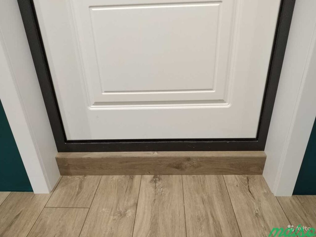 The baseboard at the entrance door