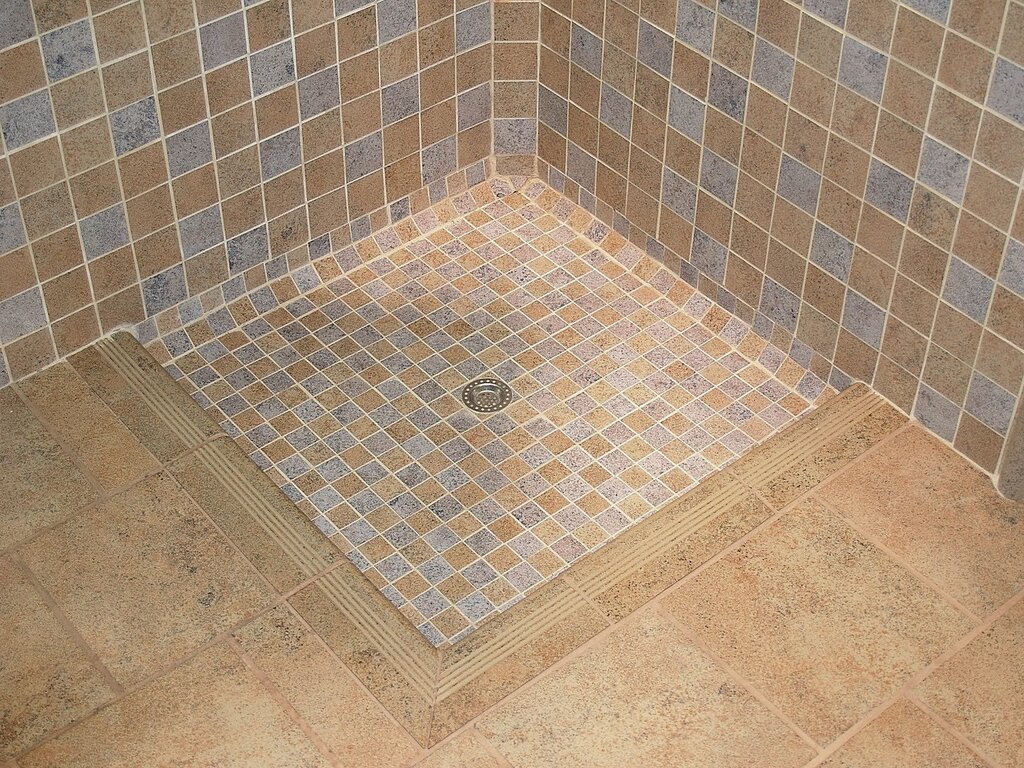 Shower tray tile with drain