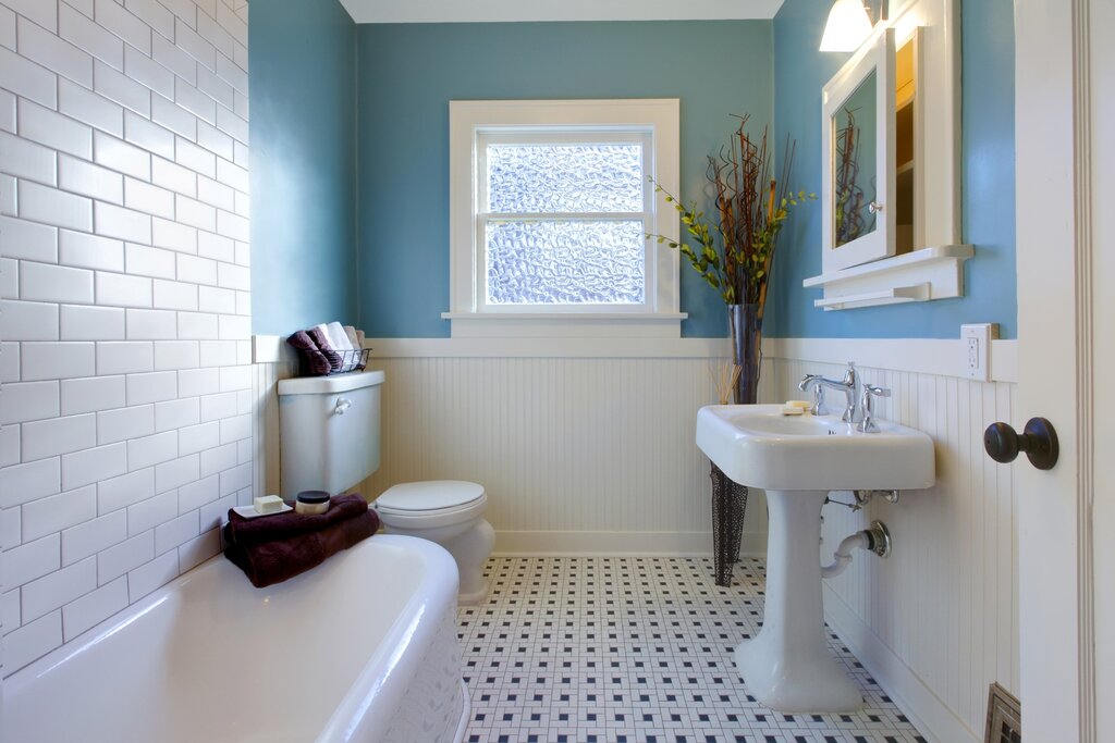 Tiles up to the middle of the wall in the bathroom