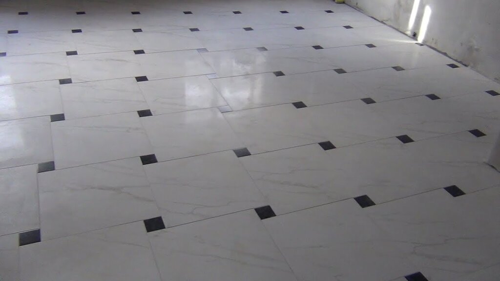 Tile with inserts on the floor