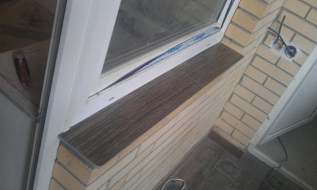 Window sill made of tiles on the balcony