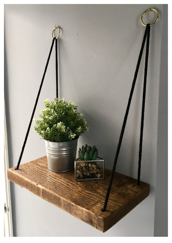 A shelf on ropes for flowers