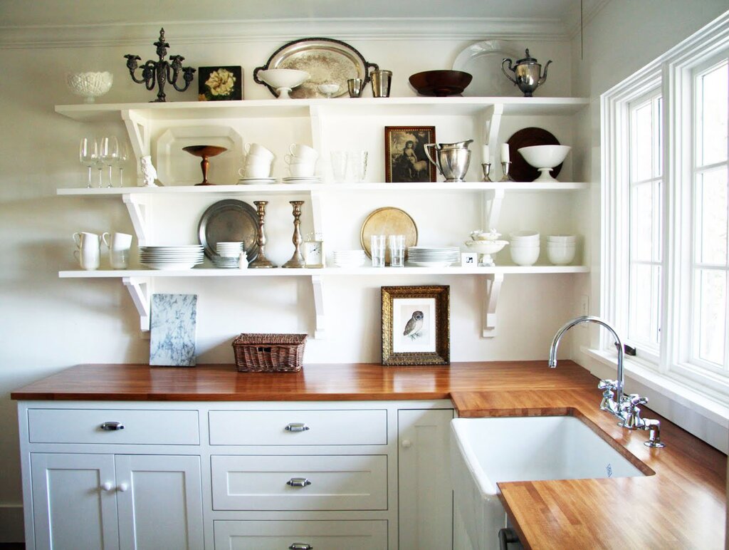 The shelf above the countertop in the kitchen