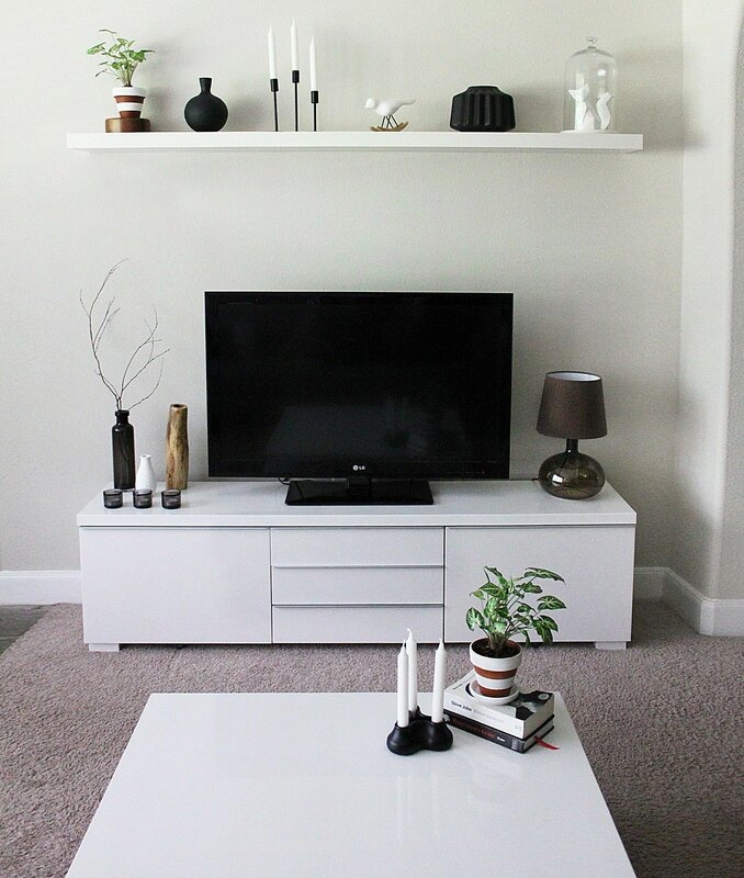 The shelf under the TV in the interior