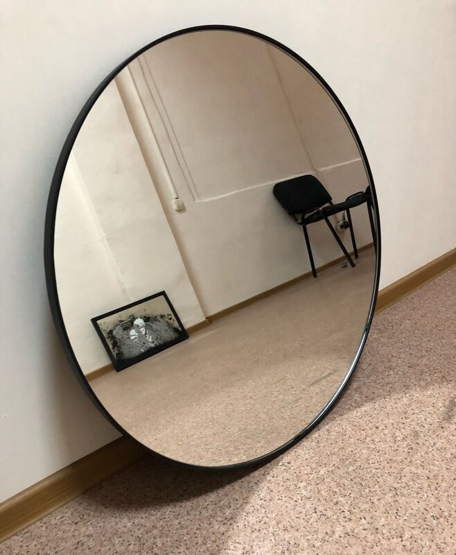 A semicircular mirror for the hallway