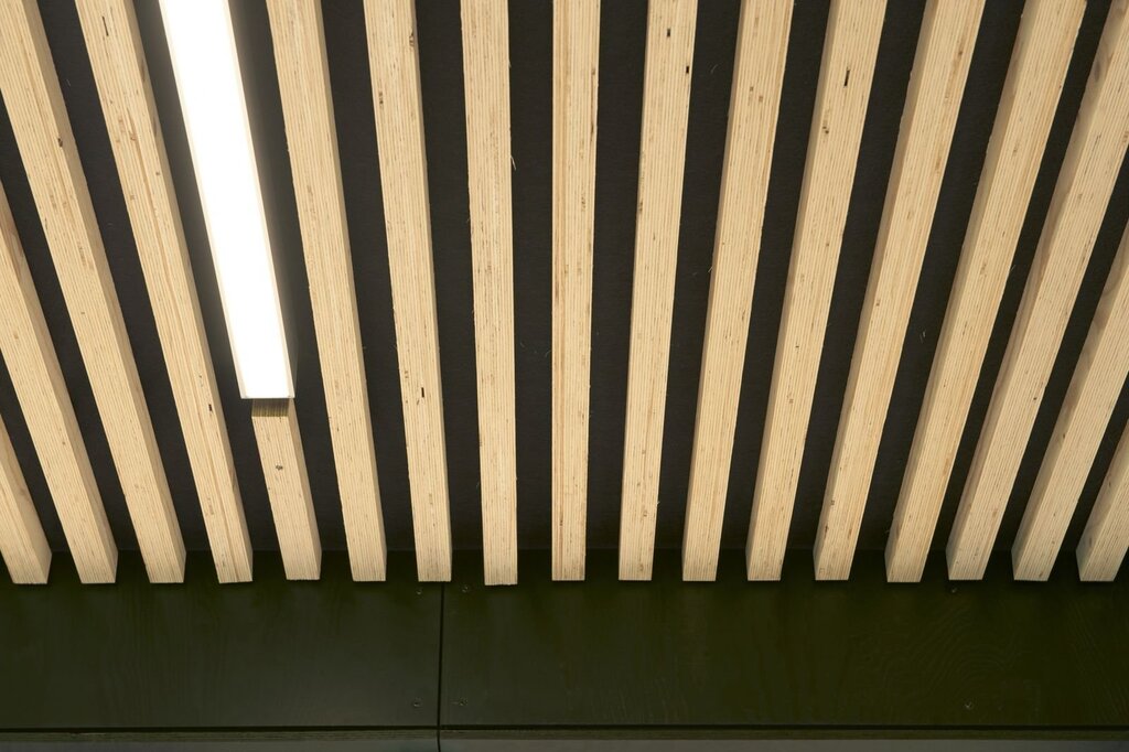 A ceiling made of wooden slats with gaps