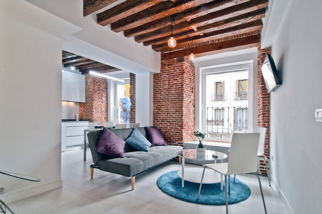 A ceiling with beams in a loft style