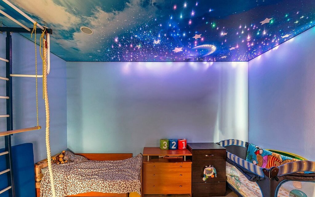 The ceiling is a starry sky in the children's room