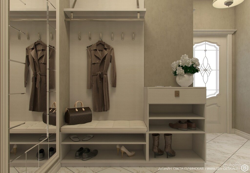 An entryway with a bench and a coat rack