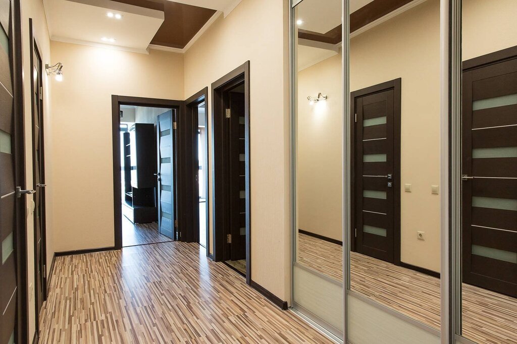 Hallway with dark doors