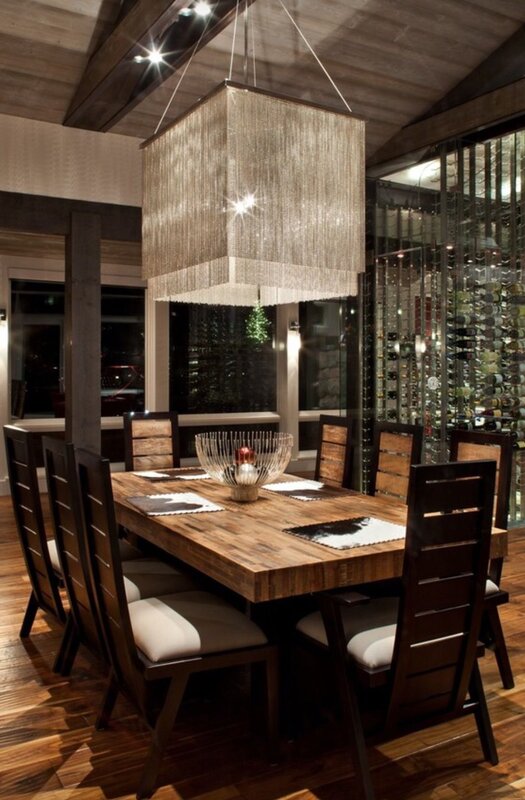 Rectangular chandelier above the table