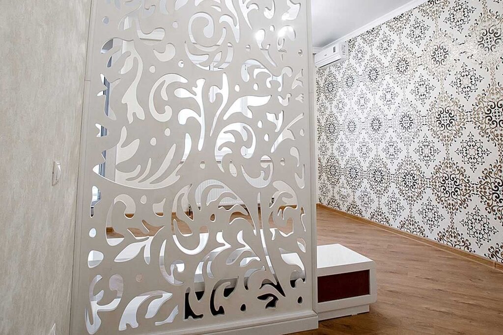 Carved partition for room zoning