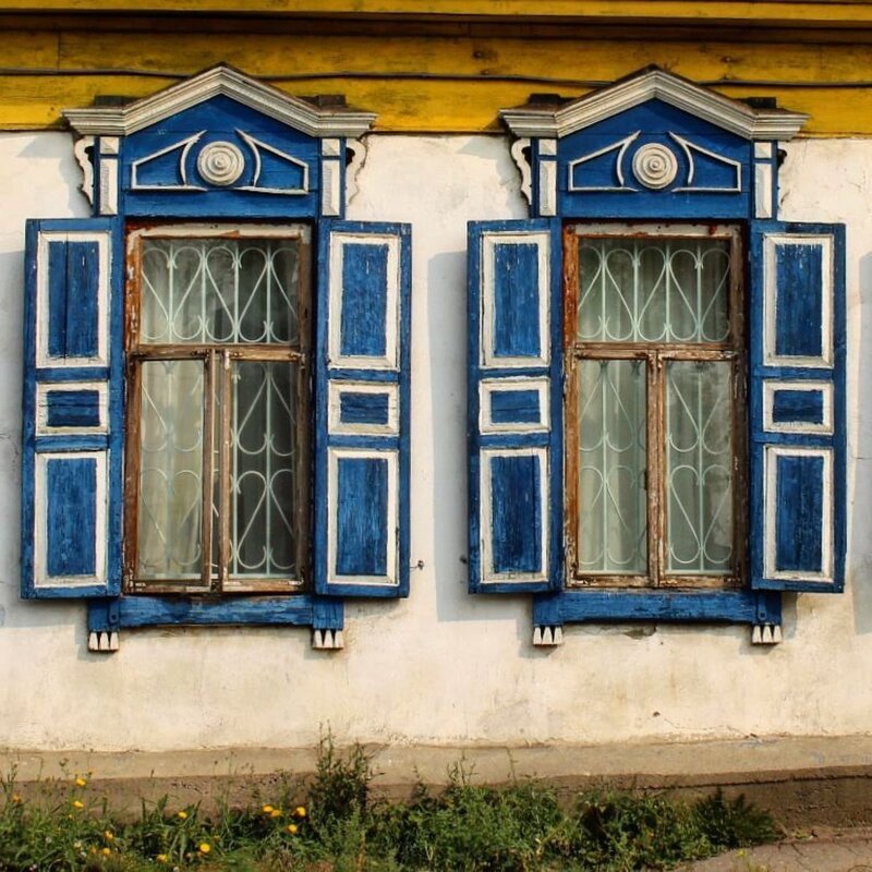 Carved window shutters