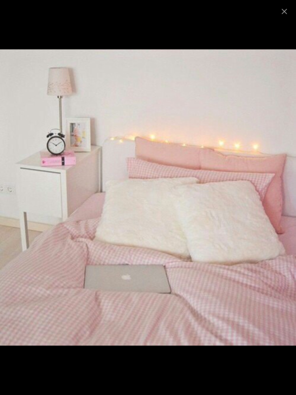 A pink bed in the bedroom interior