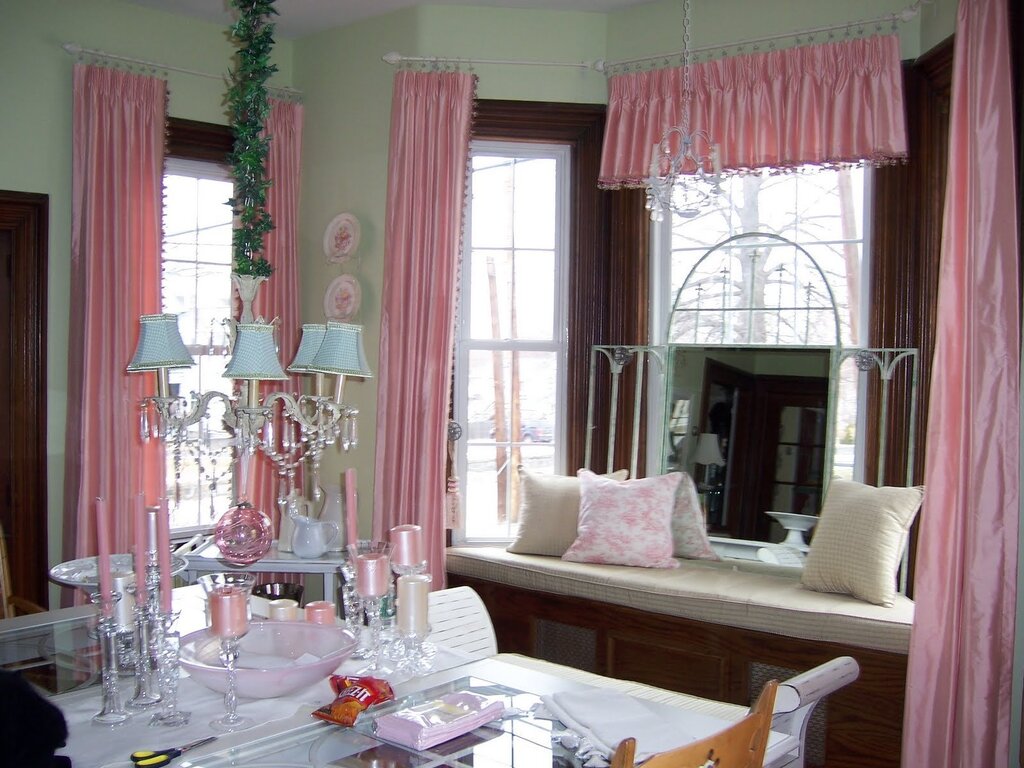 Pink curtains in the kitchen interior