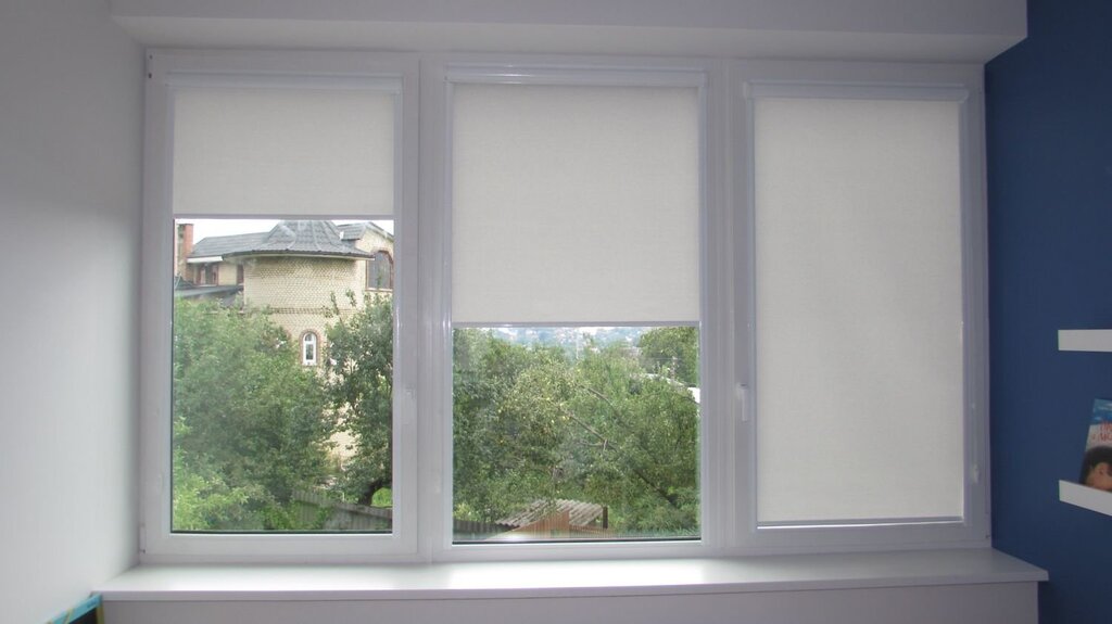 Roller blinds for a three-section window