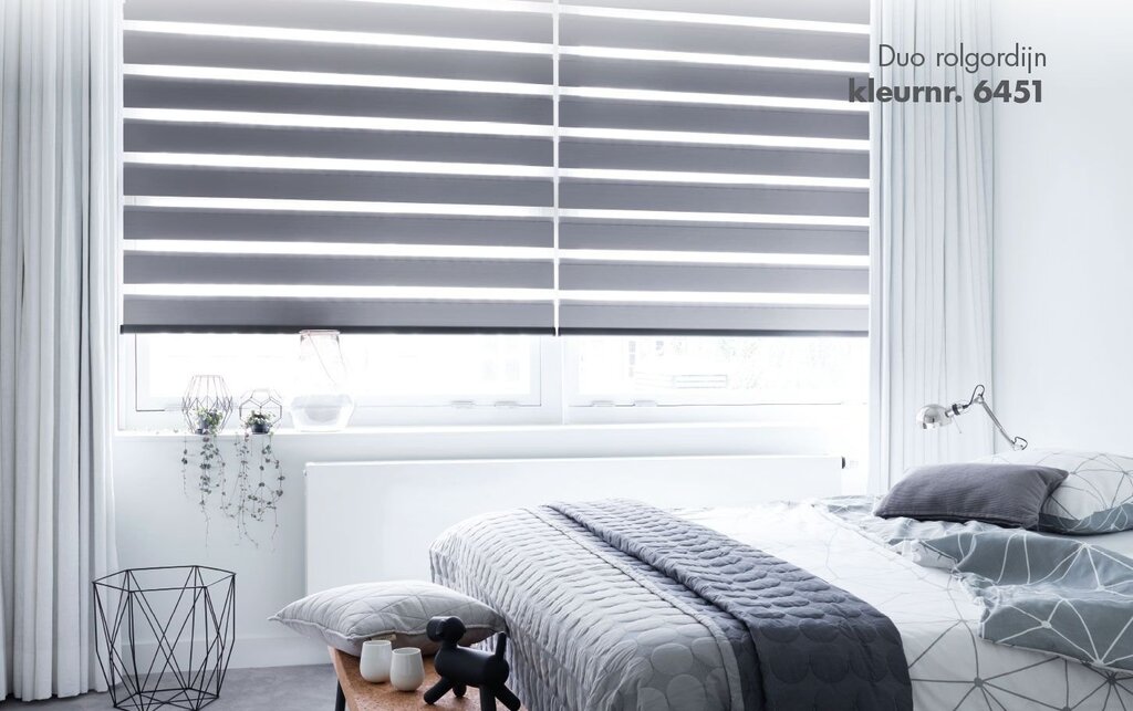 Roller blinds in the bedroom interior