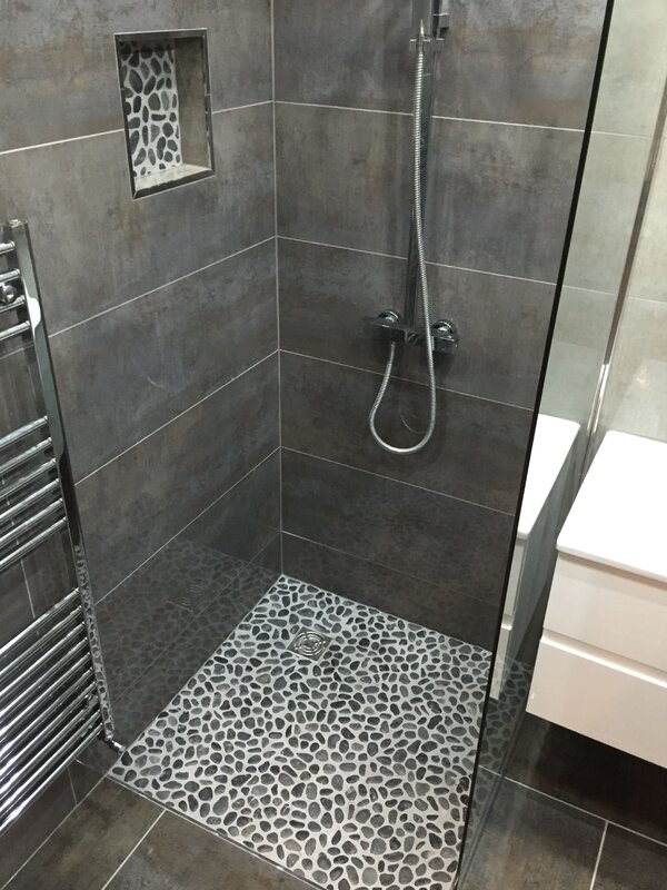 A bathroom with a shower tray