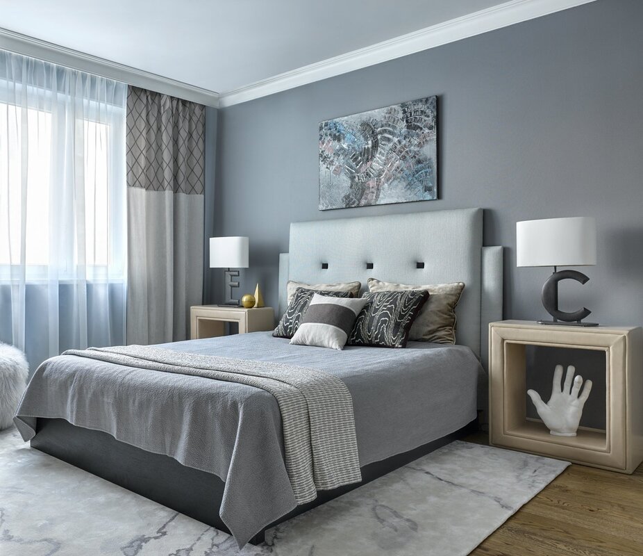 A grey bed in the bedroom interior