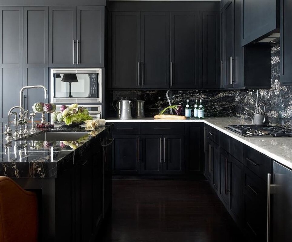 Gray kitchen with a black backsplash