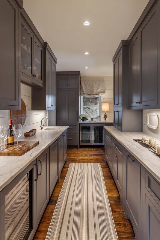 Gray kitchen with wooden floor