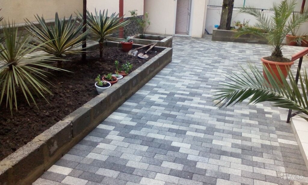 Gray tiles in the yard of a private house