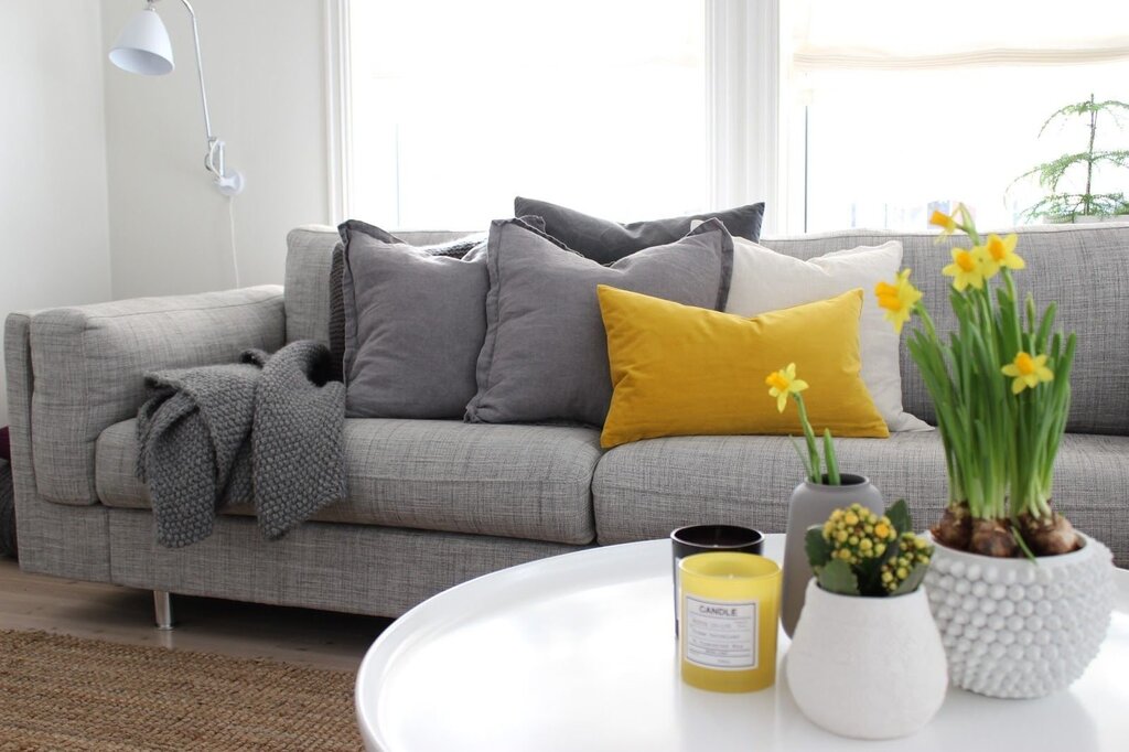 Gray sofa with yellow pillows