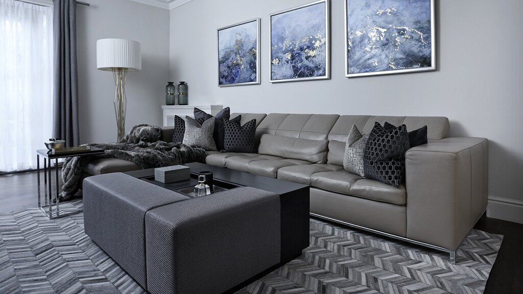 A gray corner sofa in the living room interior