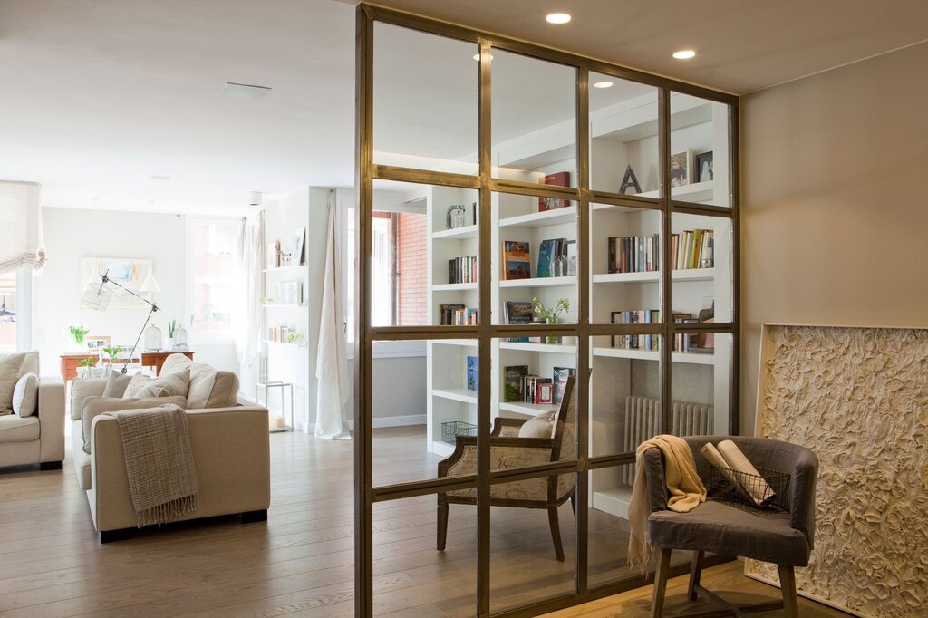 A screen between the kitchen and the living room