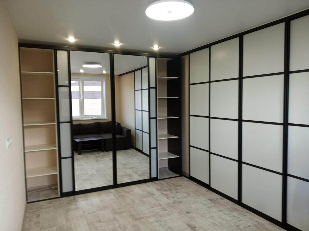 A sliding wardrobe with a door to the room