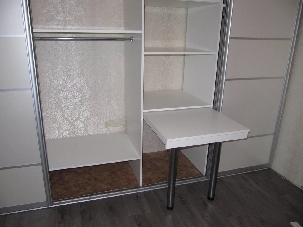 Wardrobe with pull-out table