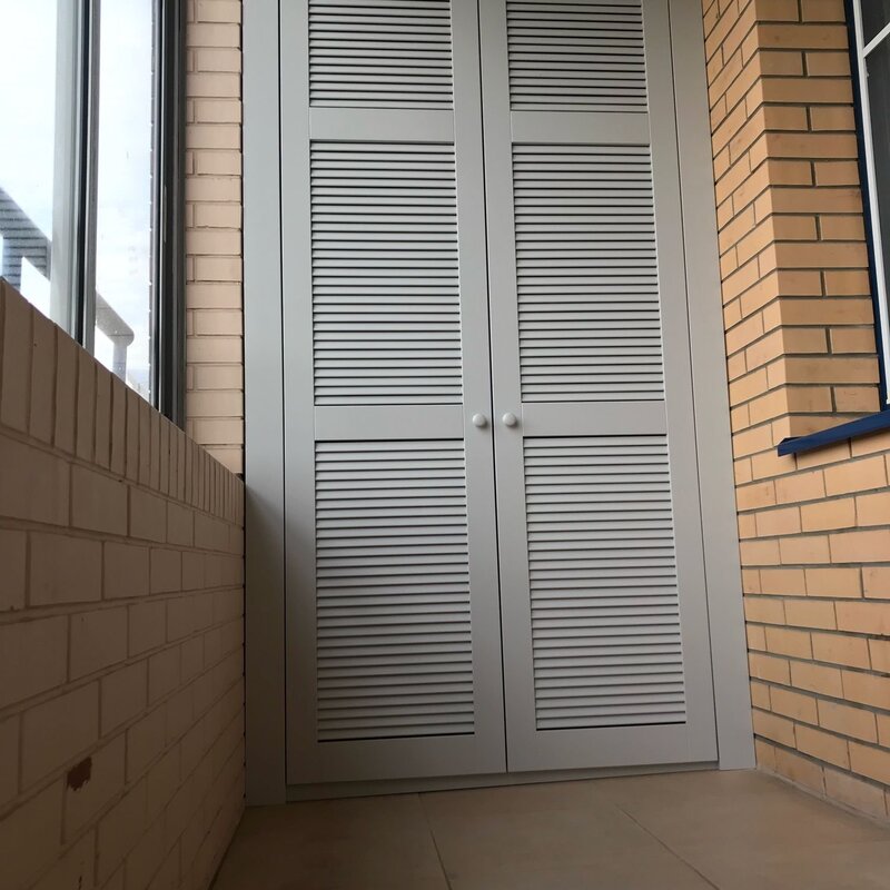 Wardrobe for the balcony with louvered doors