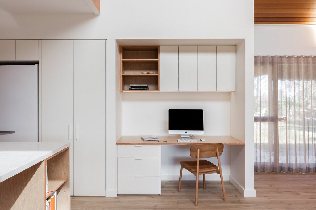 The cabinet above the desk