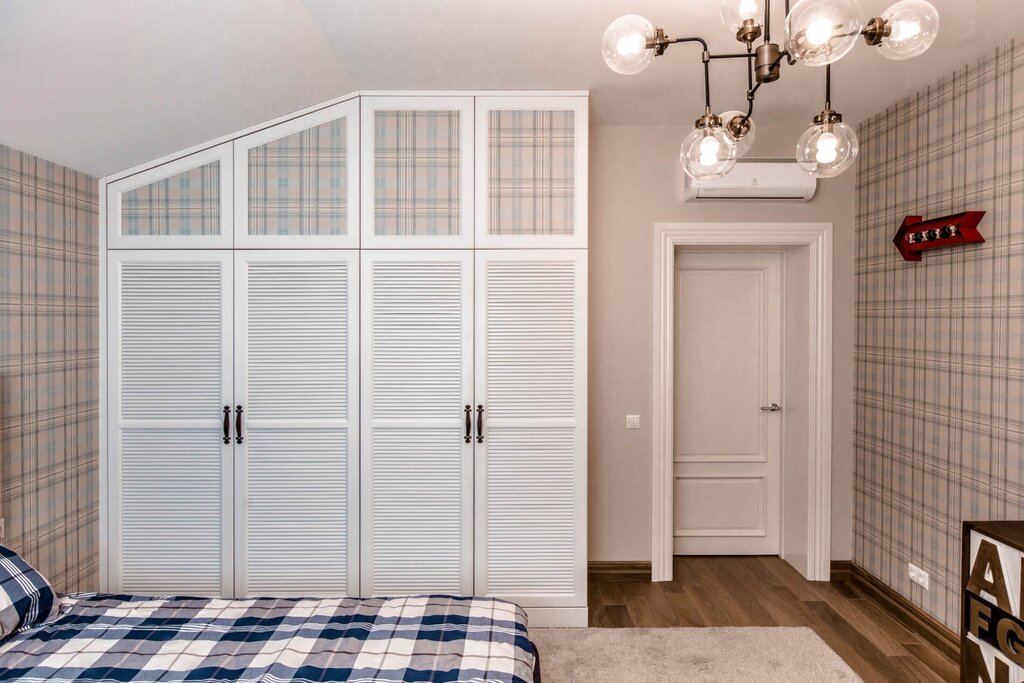 A cabinet with louvered doors