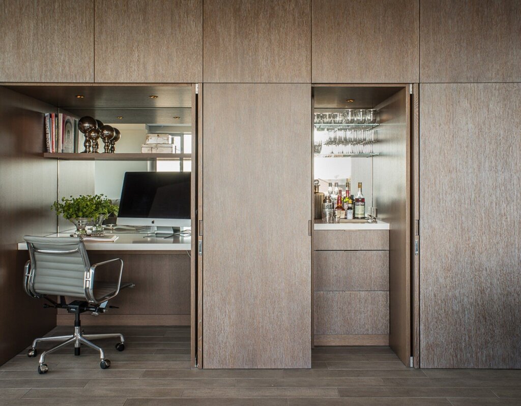 A cabinet with a built-in desk