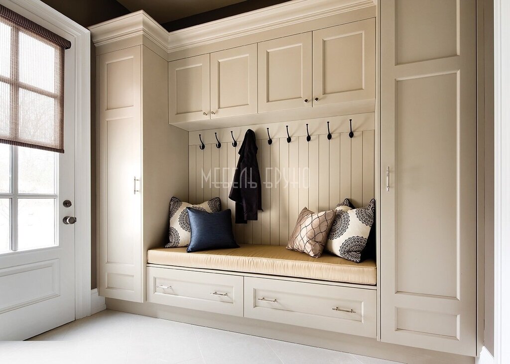 A wardrobe in the hallway with a pouf