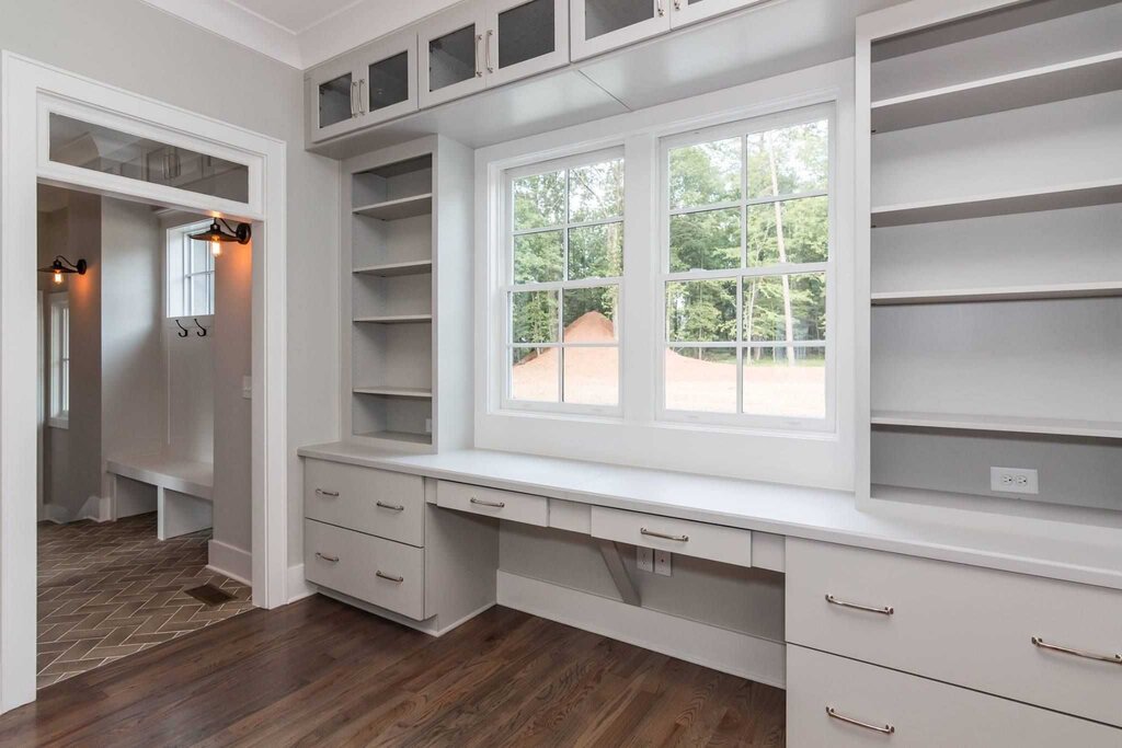 Cabinets around the window in a small room