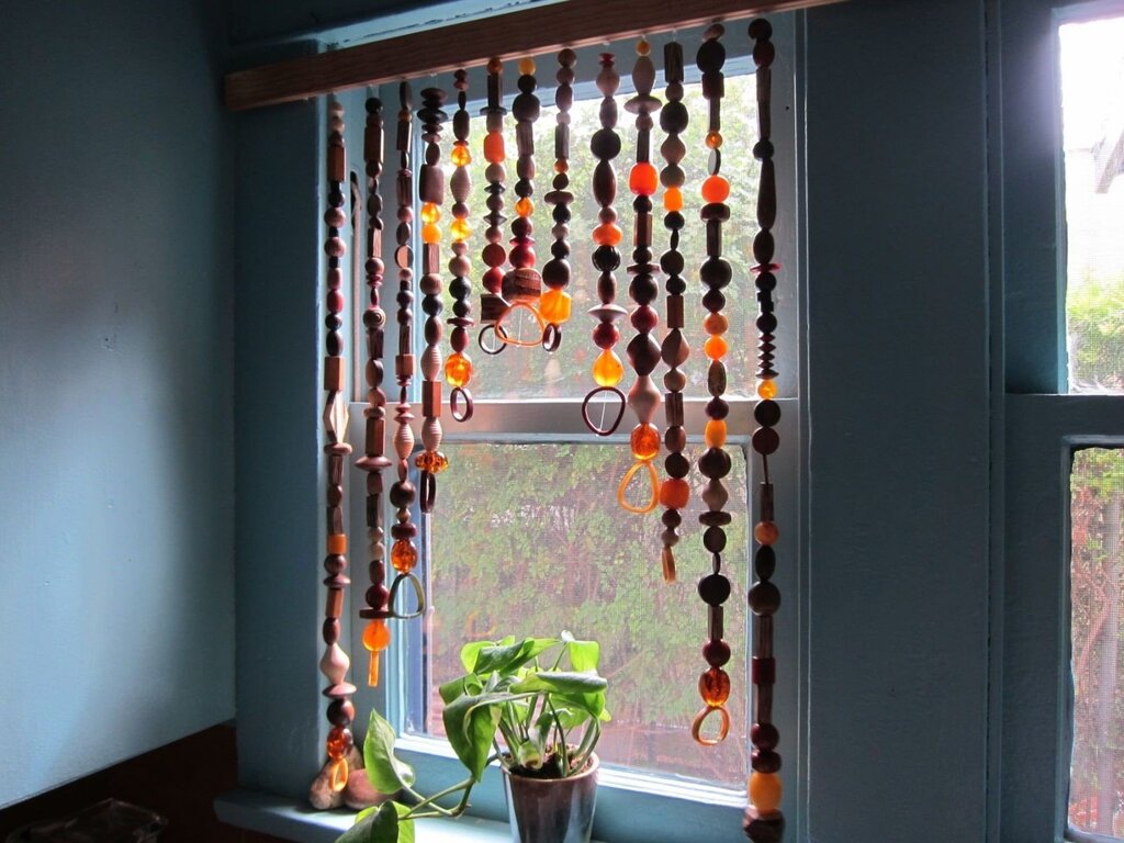 Beaded curtains for a door opening