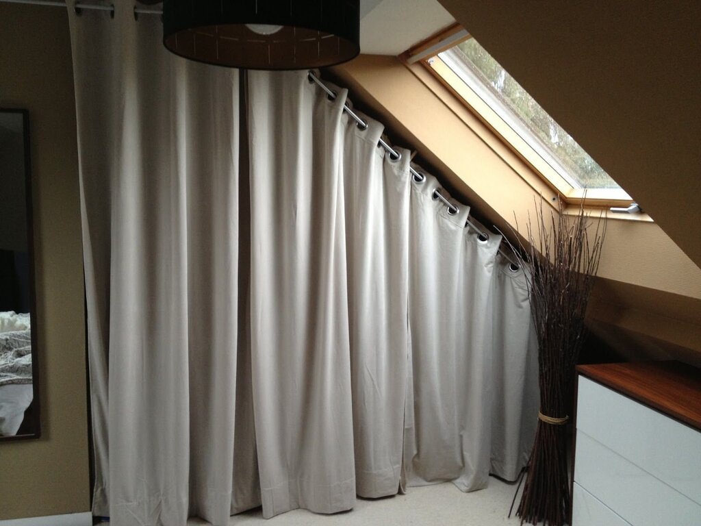 Curtains for an attic window with a slope