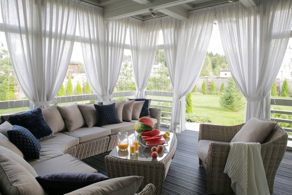 Curtains on the veranda in the country house