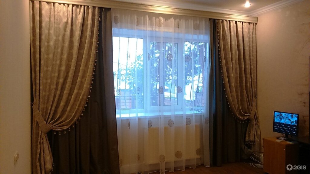 The curtains are not on the entire wall