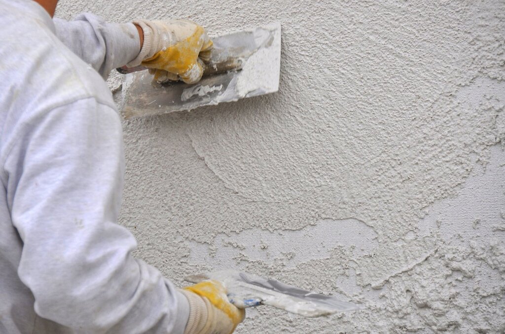 Plastering walls with cement mortar