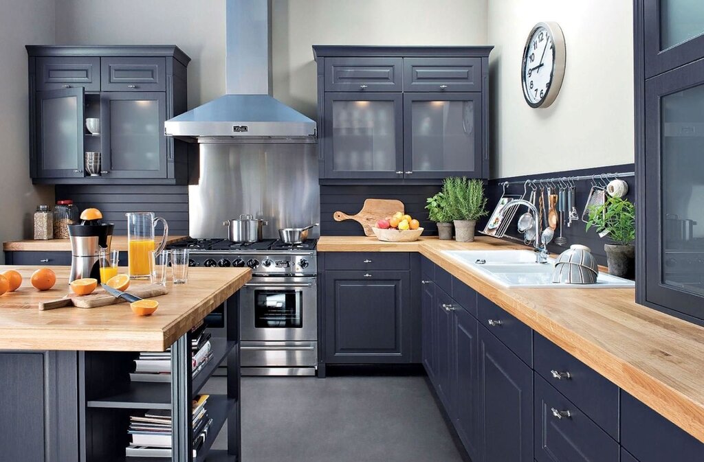 Blue-gray kitchen with a wooden countertop