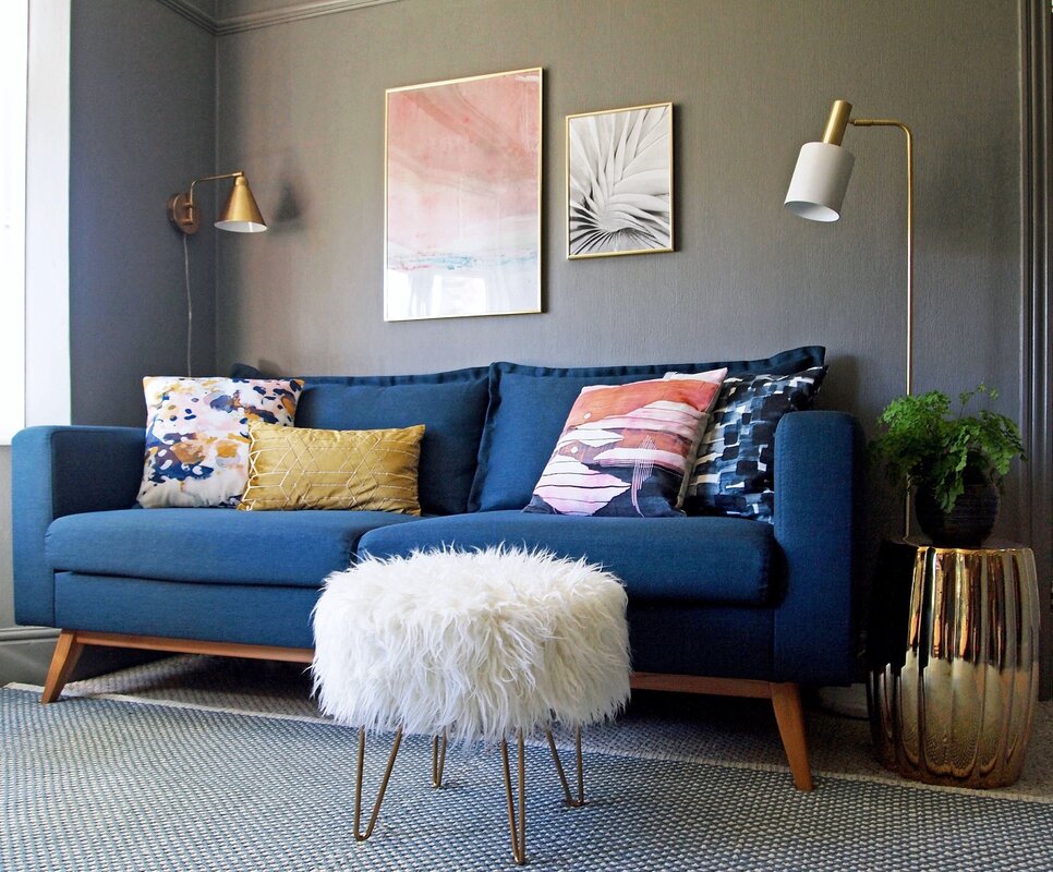 Blue sofa in a gray interior