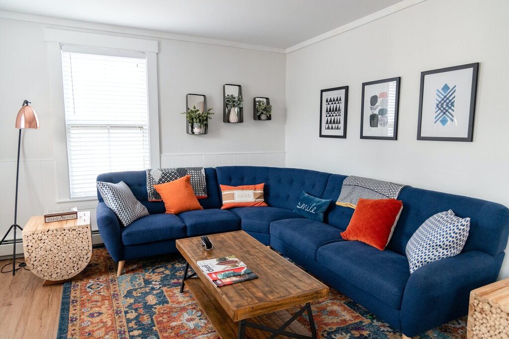 A blue sofa in the hall