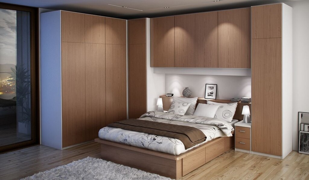 Bedroom set with cabinets at the headboard