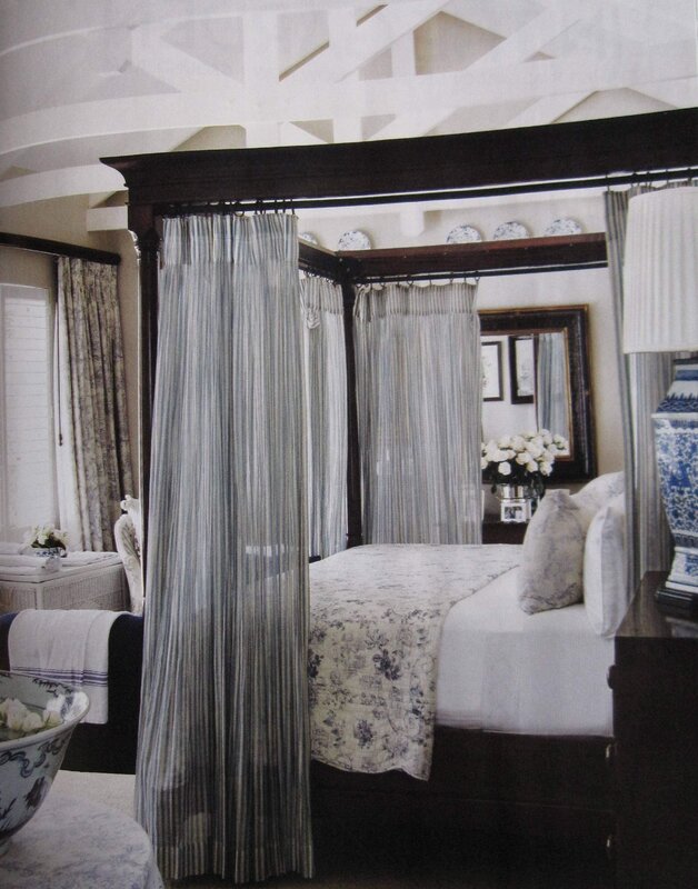 A bedroom with a canopy