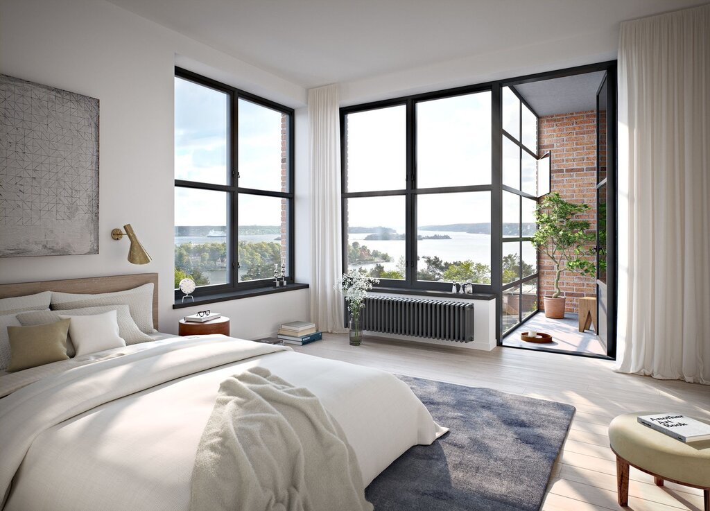 Bedroom with a balcony and a window