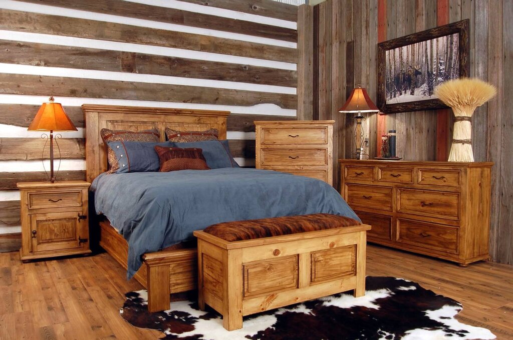 A bedroom with wooden furniture