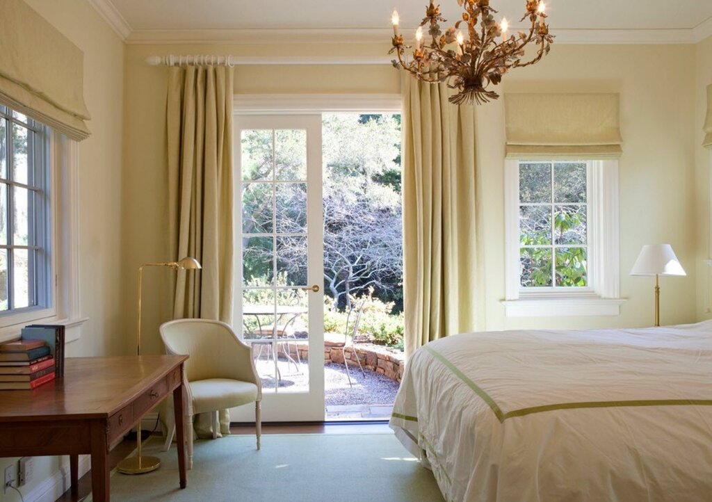 A bedroom with a French window